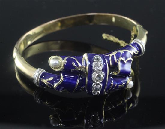 A gold, split pearl, diamond and blue enamel crossover hinged bangle,
